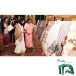 President of India - Ms. Murmu looking at a painting by Renuka